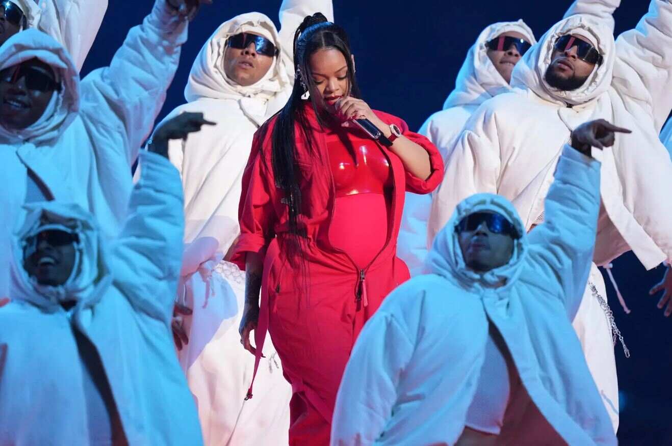 Rihanna Shocks the World with Her High-Energy Super Bowl Performance in a Bold Red Outfit!